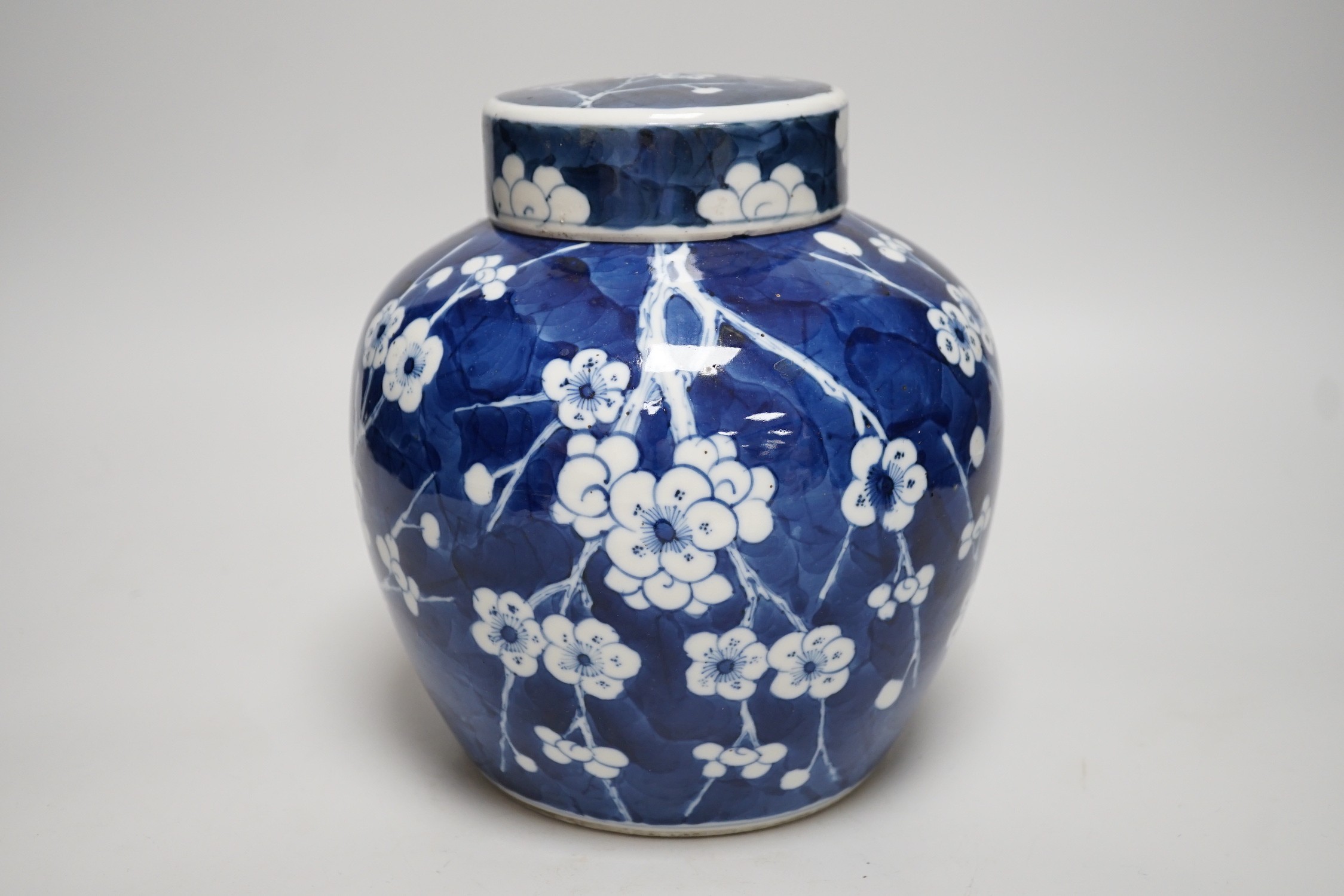 A Chinese blue and white prunus jar and cover, late 19th century, 20.5cms high